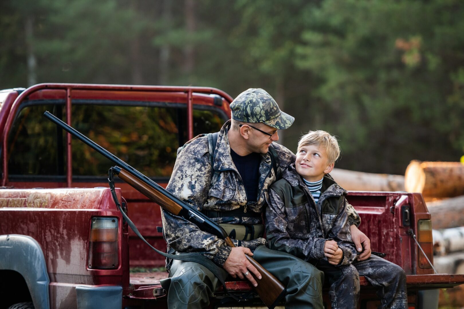 Hunter with his son during the rest sitting inside the pickup truck